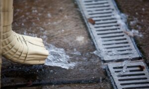 Rain water rushing into a drain